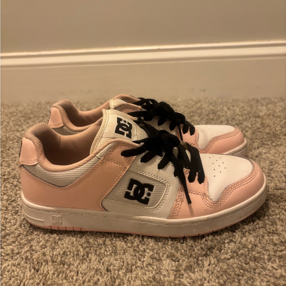 Pink, black, and white DC women’s shoes in size 9.5